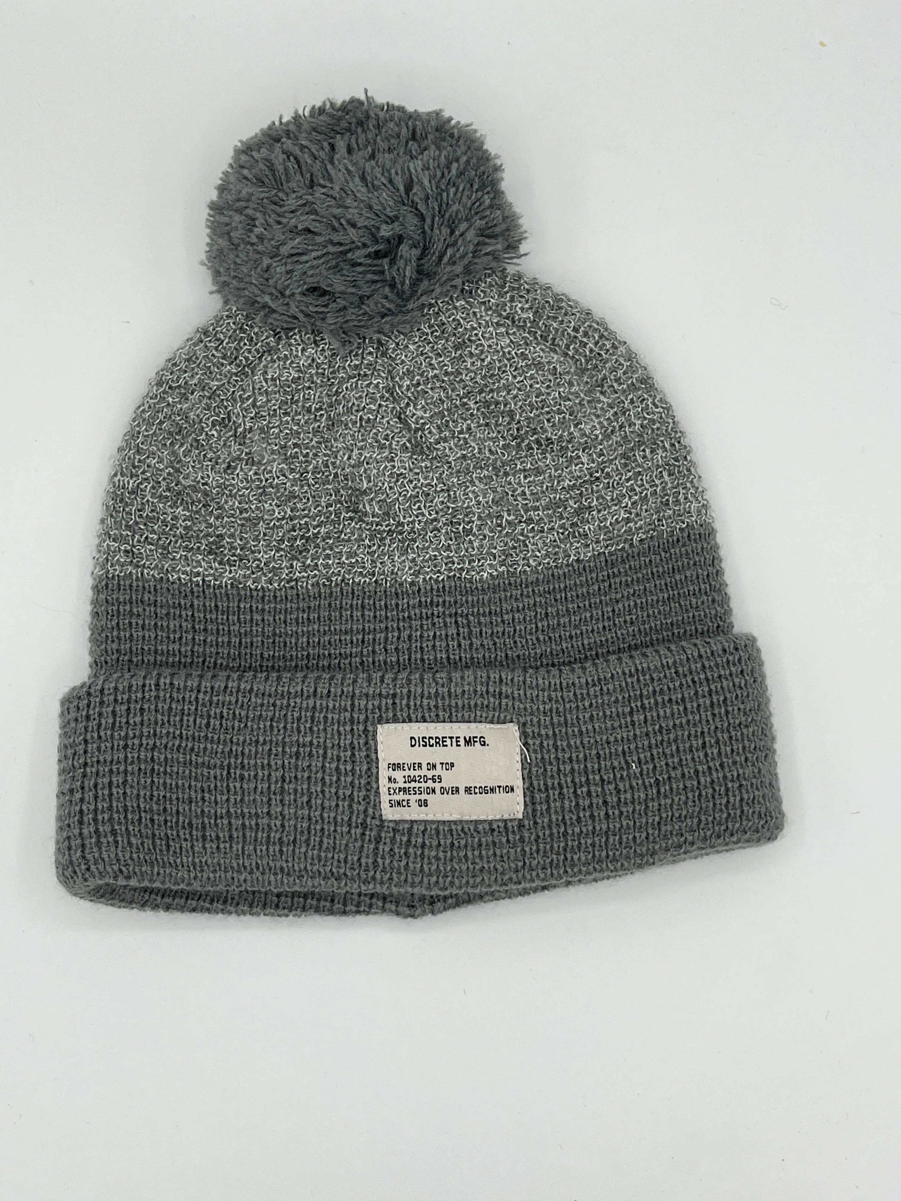 Discrete MFG Pom Pom Beanie